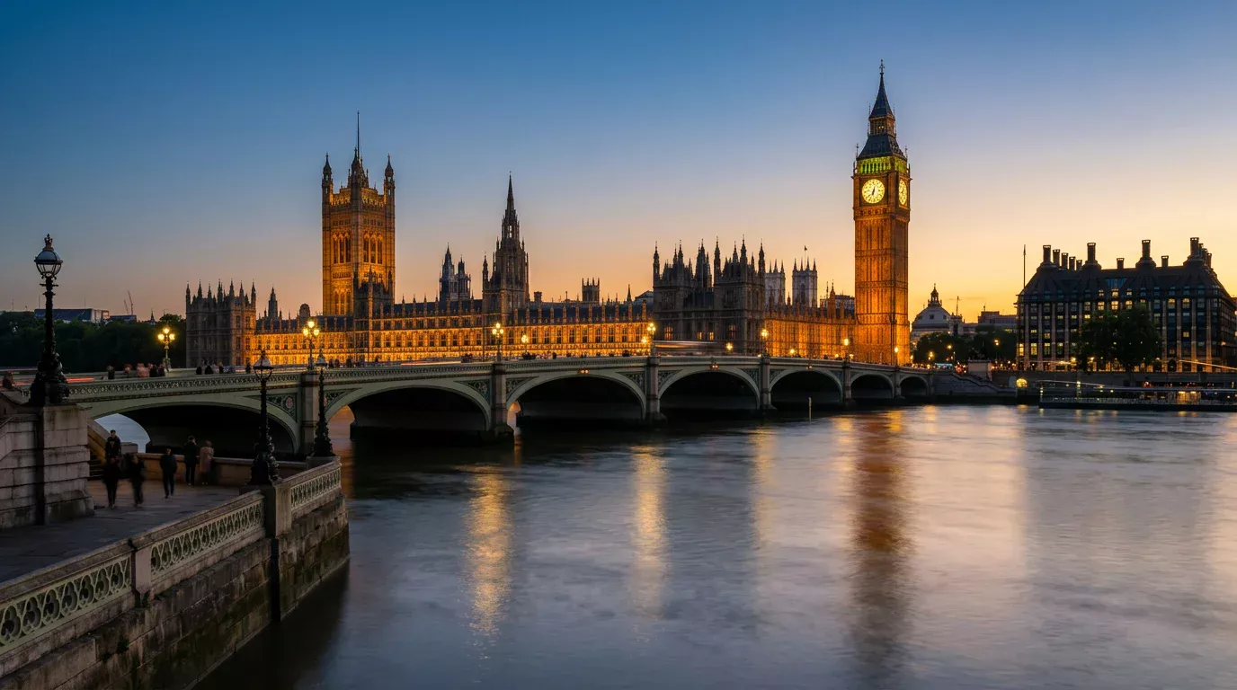 The Palace of Westminster at dusk with city lights reflecting on the Thames, symbolising UK gambling legislation changes